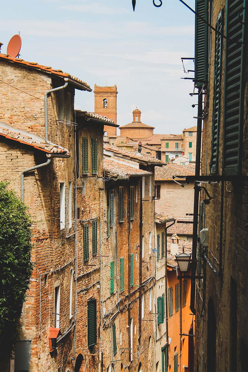 Old authentic buildings in streets of Siena